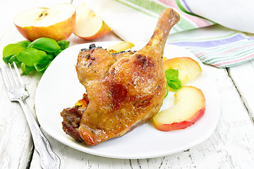 Image showing Duck leg with apple on light board