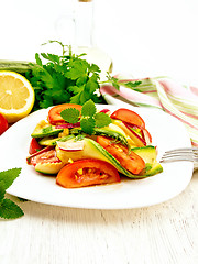 Image showing Salad with zucchini and tomato on board