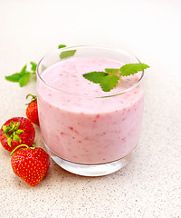 Image showing Milkshake strawberry on stone table