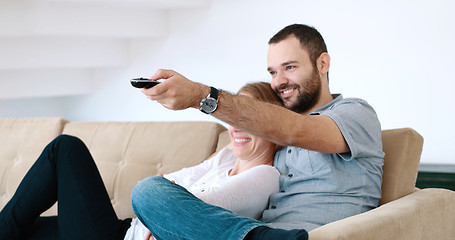 Image showing senoior couple watching tv in modern villa