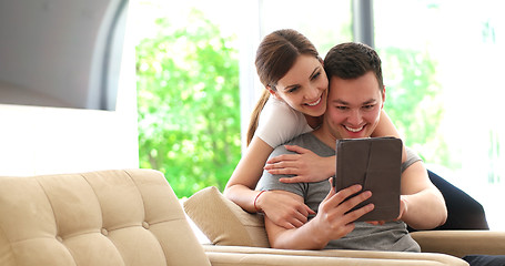 Image showing Young Couple using digital tablet at home