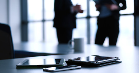 Image showing tablet, mobile cell phone and cup of coffee  in office with busi