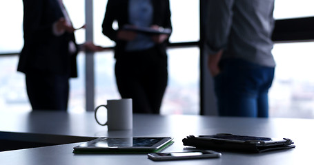 Image showing tablet, mobile cell phone and cup of coffee  in office with busi