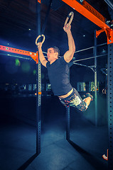 Image showing Concept: power, strength, healthy lifestyle, sport. Powerful attractive muscular man at CrossFit gym