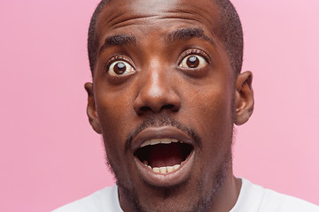 Image showing The portrait of handsome young surprised black african man