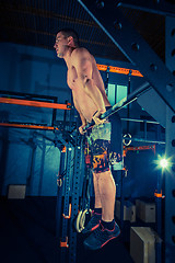 Image showing Concept: power, strength, healthy lifestyle, sport. Powerful attractive muscular man at CrossFit gym