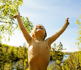 Image showing little cute boy enjoing nature on the top of mountain, lifestyle people concept