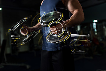 Image showing close up of man with dumbbells exercising in gym