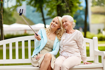 Image showing daughter and senior mother taking selfie at park