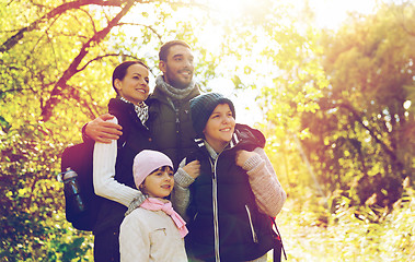 Image showing happy family with backpacks hiking