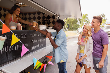 Image showing happy customers queue at food truck