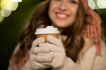 Image showing happy woman with coffee over christmas lights