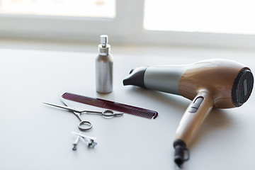 Image showing hairdryer, scissors, comb and styling hair spray