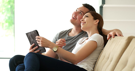 Image showing Young Couple using digital tablet at home