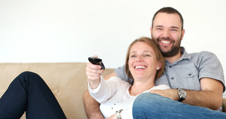 Image showing senoior couple watching tv in modern villa