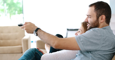 Image showing senoior couple watching tv in modern villa