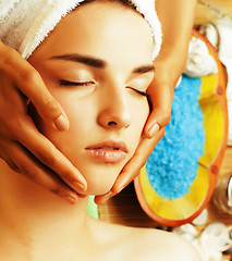 Image showing stock photo attractive lady getting spa treatment in salon, close up asian hands on face