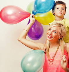 Image showing pretty real family with color balloons on white background, blon