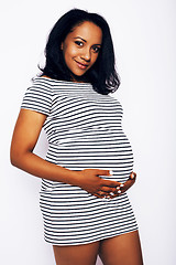 Image showing young pretty african american woman pregnant happy smiling, posing on white background isolated , lifestyle people concept copyspace 