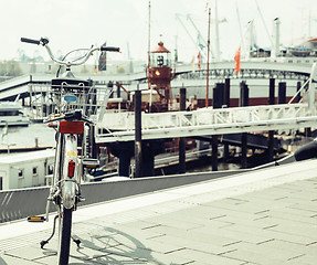 Image showing postcard view of Hamburg harbour, parking bicycle at the shore