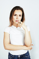 Image showing young pretty teenage girl posing cheerful happy smiling on white background, lifestyle people concept