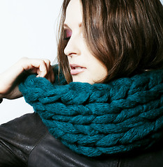 Image showing young pretty real woman in sweater and scarf all over her face s