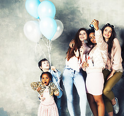 Image showing Lifestyle and people concept: young pretty diversity nations woman with different age children celebrating on birth day party together happy smiling, making selfie. African-american, asian and caucasi