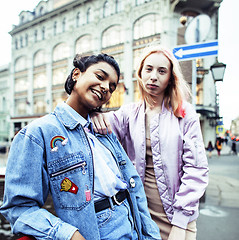 Image showing Two teenage girls infront of university building smiling, having fun, lifestyle real people concept 