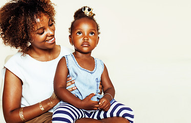 Image showing adorable sweet young afro-american mother with cute little daughter, hanging at home, having fun playing smiling, lifestyle people concept, happy smiling modern family 