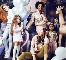 Image showing Lifestyle and people concept: young pretty diversity nations woman with different age children celebrating on birth day party together happy smiling, making selfie. African-american, asian and caucasi