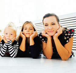 Image showing Mature sisters twins at home with little daughter, happy family 