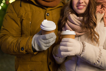 Image showing close up of happy couple with coffee at christmas