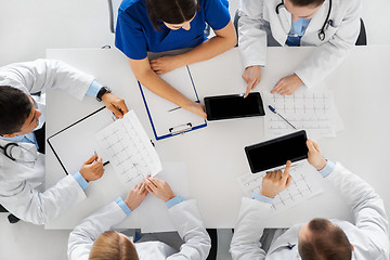 Image showing doctors with cardiograms and tablet pc at hospital