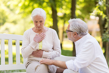 Image showing senior woman feeling sick at summer park