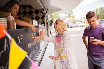 Image showing happy customers queue at food truck