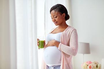 Image showing pregnant woman drinking vegetable juice at home