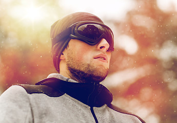 Image showing sports man with ski goggles in winter outdoors