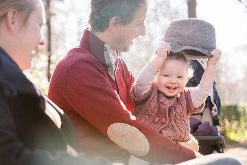 Image showing Young family with cheerful child in the park.