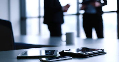 Image showing tablet, mobile cell phone and cup of coffee  in office with busi