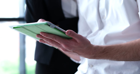 Image showing low angle shot of business people using technology