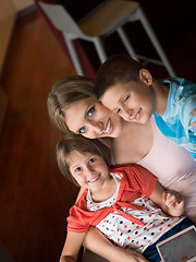 Image showing Young Family Using A Tablet To Make Future Plans