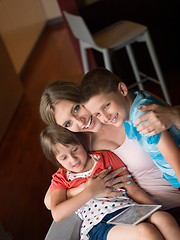 Image showing Young Family Using A Tablet To Make Future Plans