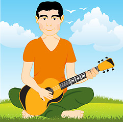 Image showing Man on glade plays on guitar