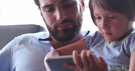 Image showing Father Daughter using Tablet in modern apartment