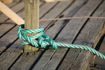 Image showing Mooring rope tied on the pier