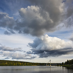 Image showing The sky with clouds and a bridge over the river. Finland