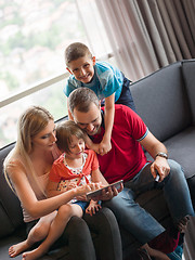 Image showing young cuple spending time with kids