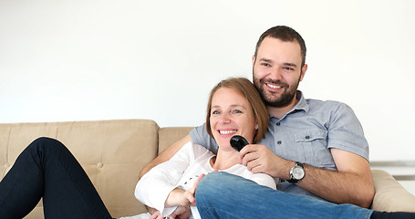 Image showing senoior couple watching tv in modern villa