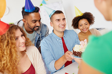 Image showing team greeting colleague at office birthday party