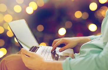 Image showing close up of man typing on laptop keyboard